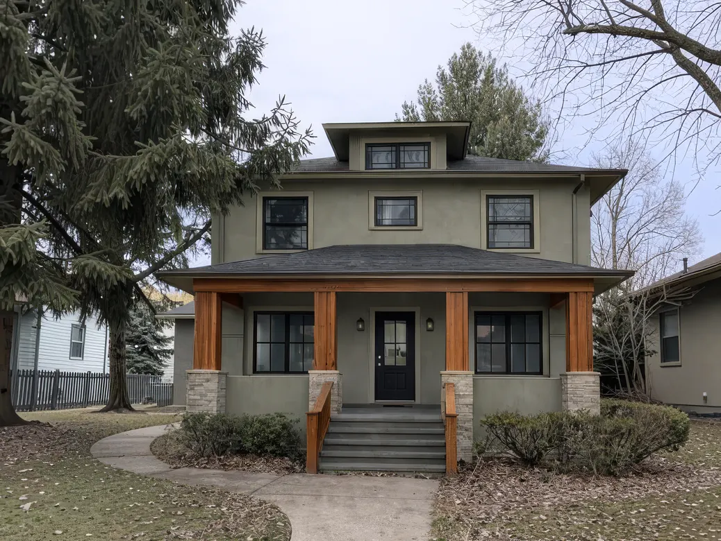 Two-story Craftsman-style home with covered front porch and wood columns